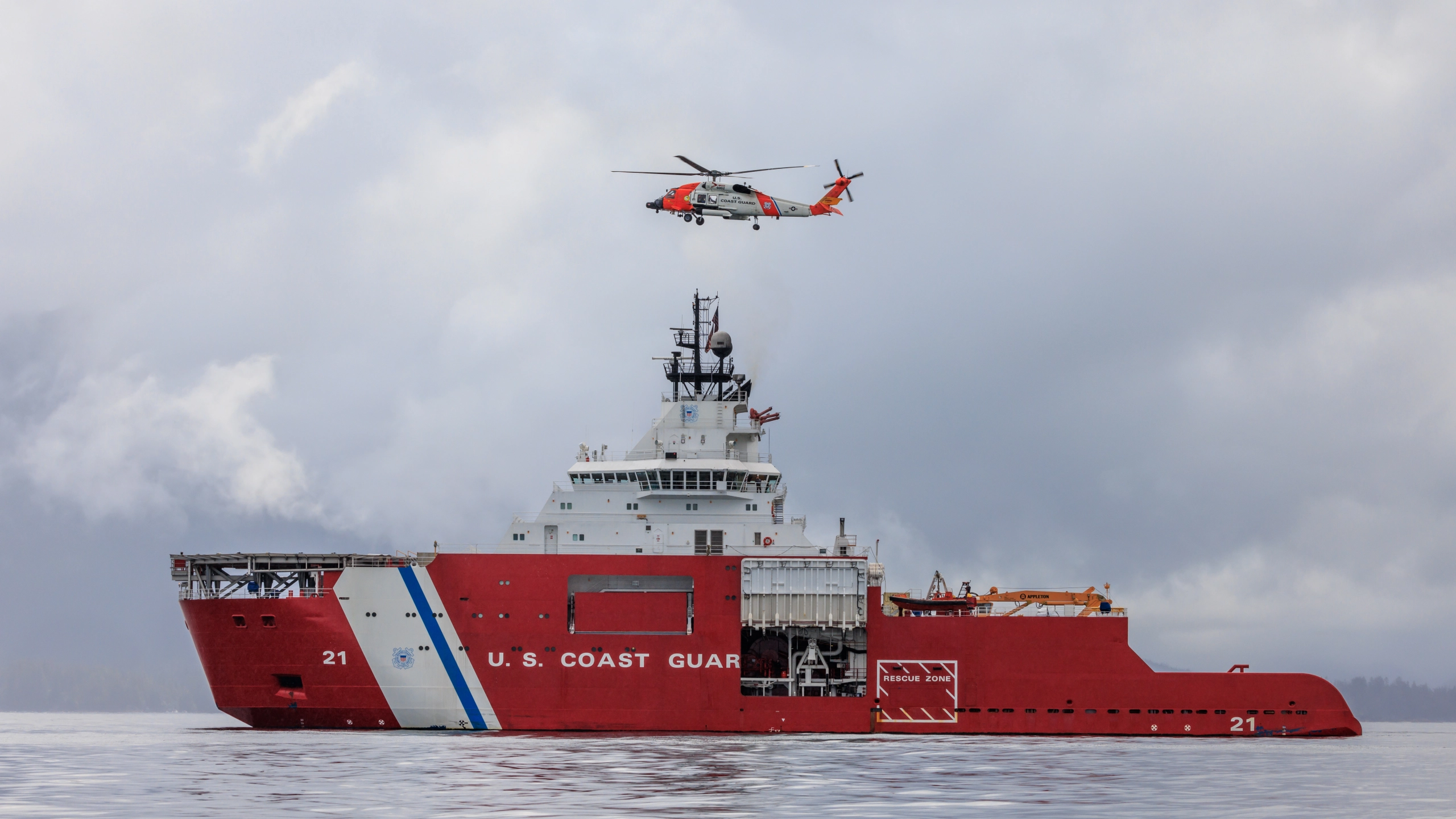 Photo of CGC STORIS (WAGB 21) with Coast Guard Helicopter overhead Photo of CGC STORIS (WAGB 21) with Coast Guard Helicopter overhead
